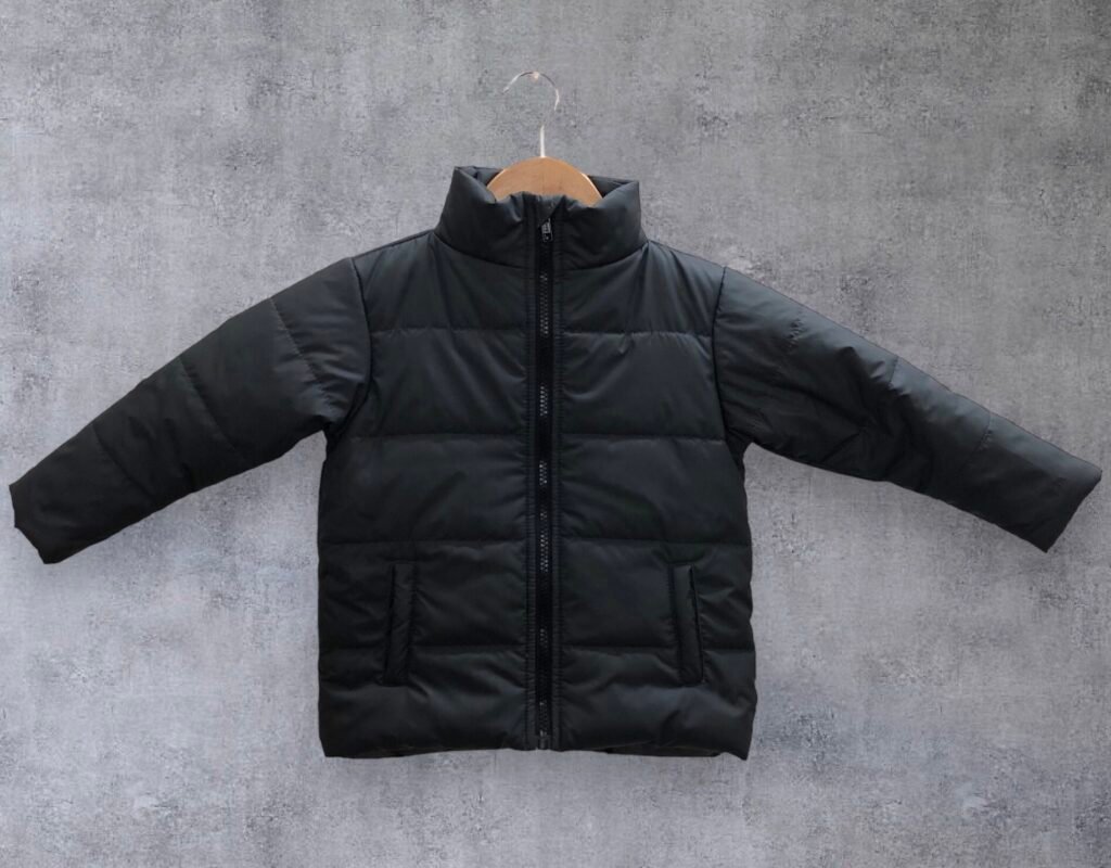 Black padded jacket with long sleeves displayed on a hanger.