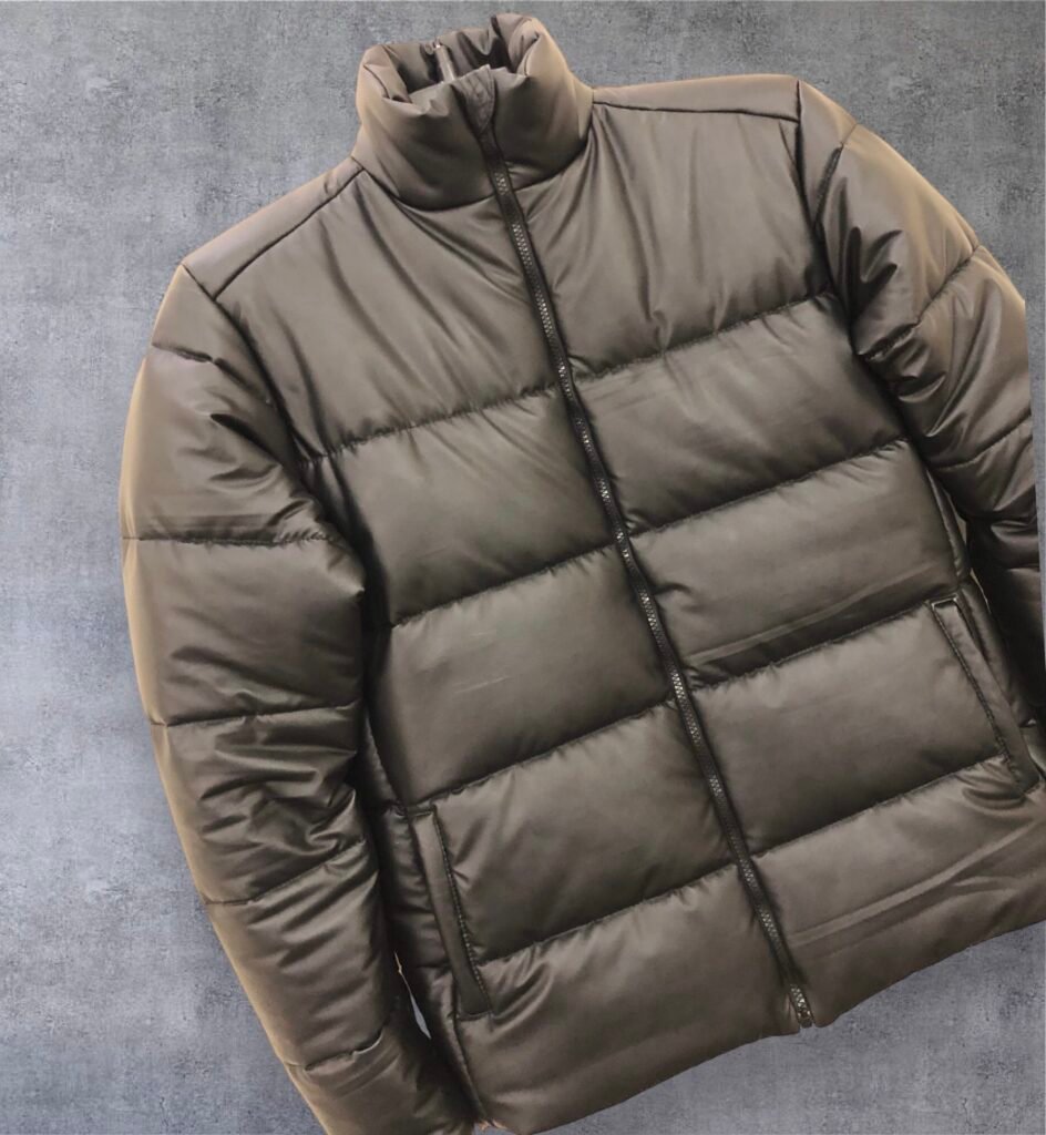Olive puffer jacket with horizontal quilting and a stand collar