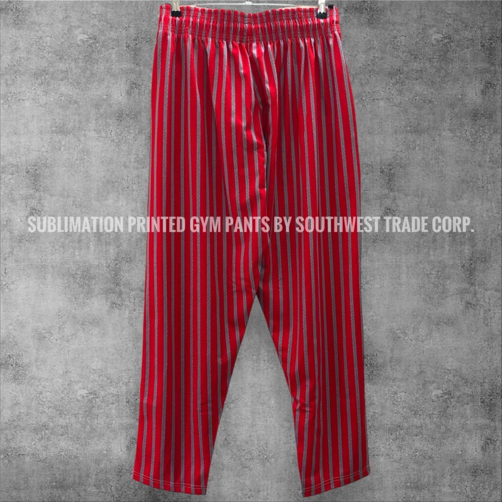 Red striped gym trousers with tapered legs.