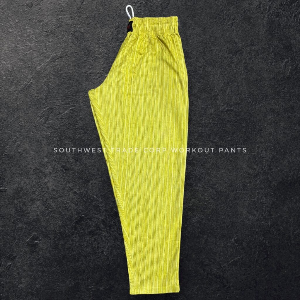 Yellow patterned workout trousers shown from the side.
