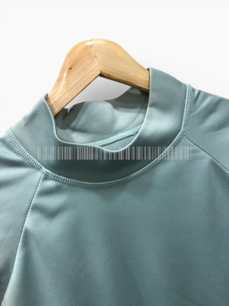 Close-up of the collar on a sage green sweatshirt.