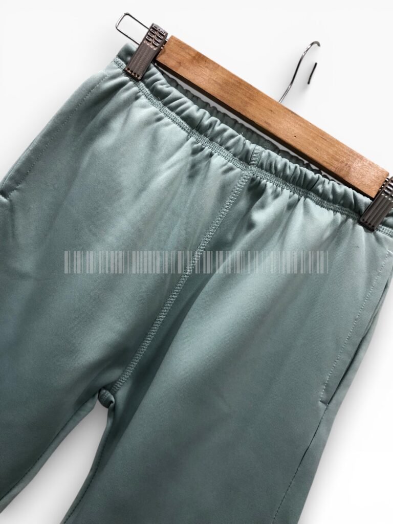 Close-up of the waistband on sage green joggers.