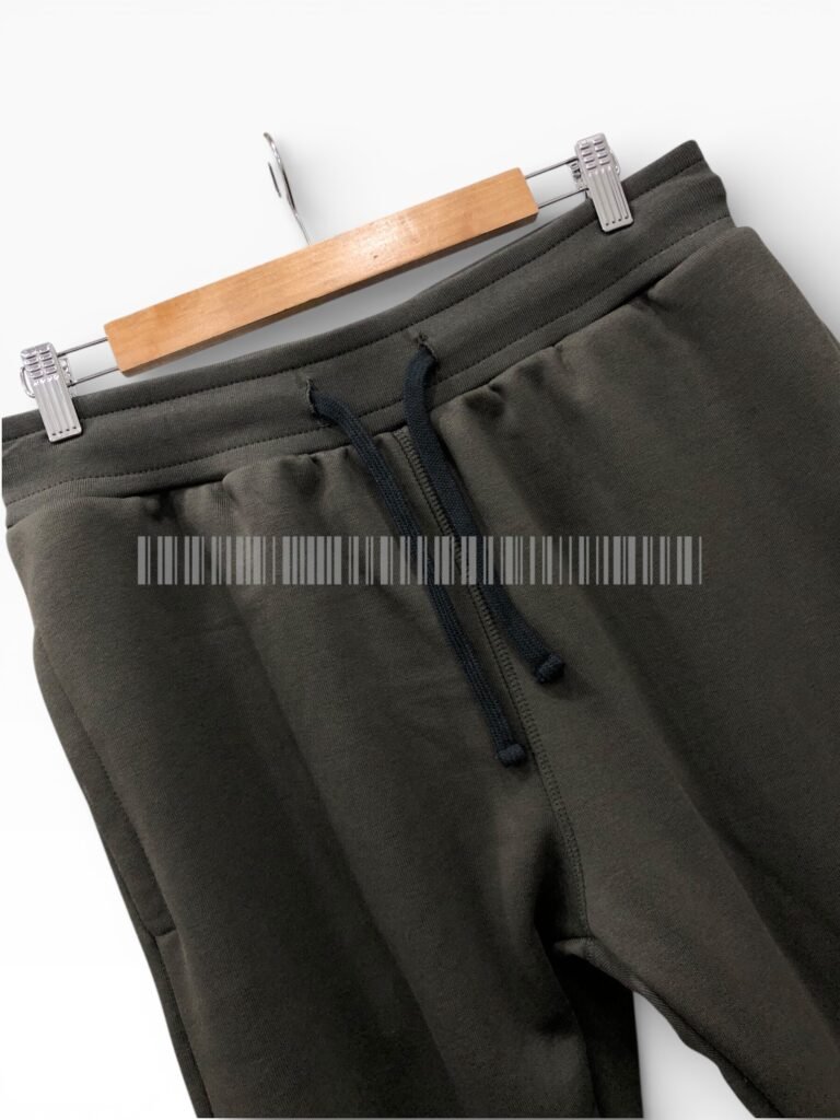 Close-up of the drawstring waistband on black joggers.