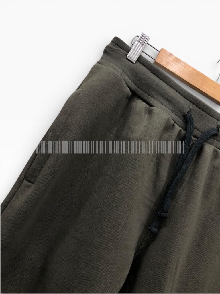 Close-up of the side pocket on black joggers.