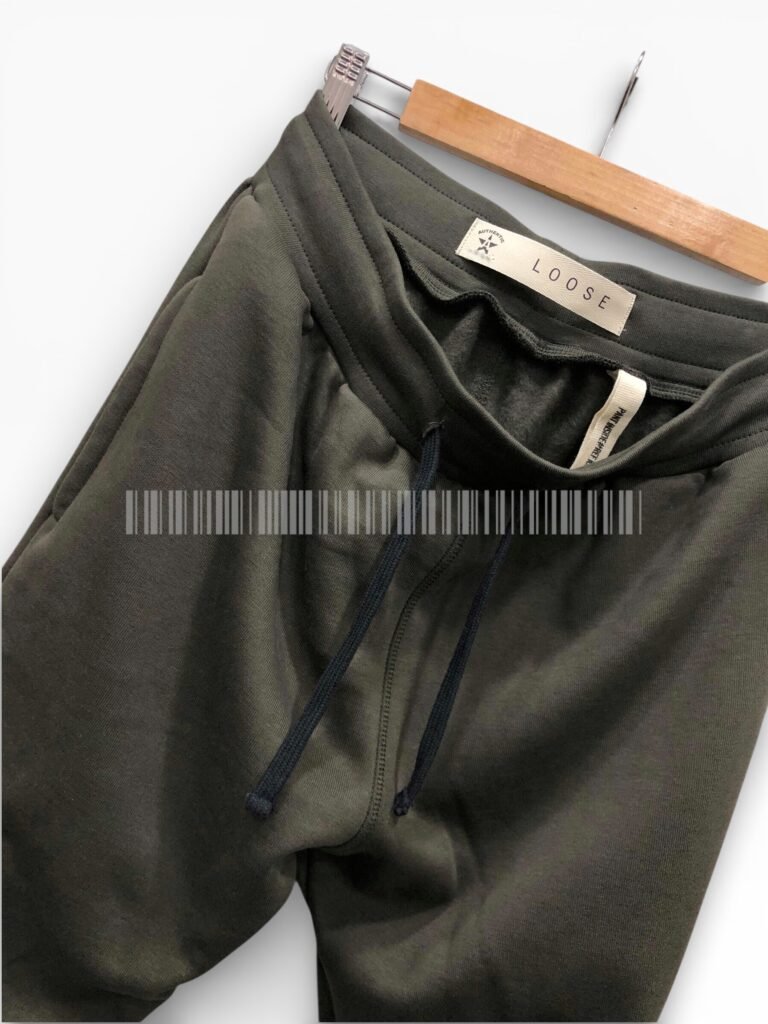 Close-up of the waistband and lining on black joggers.