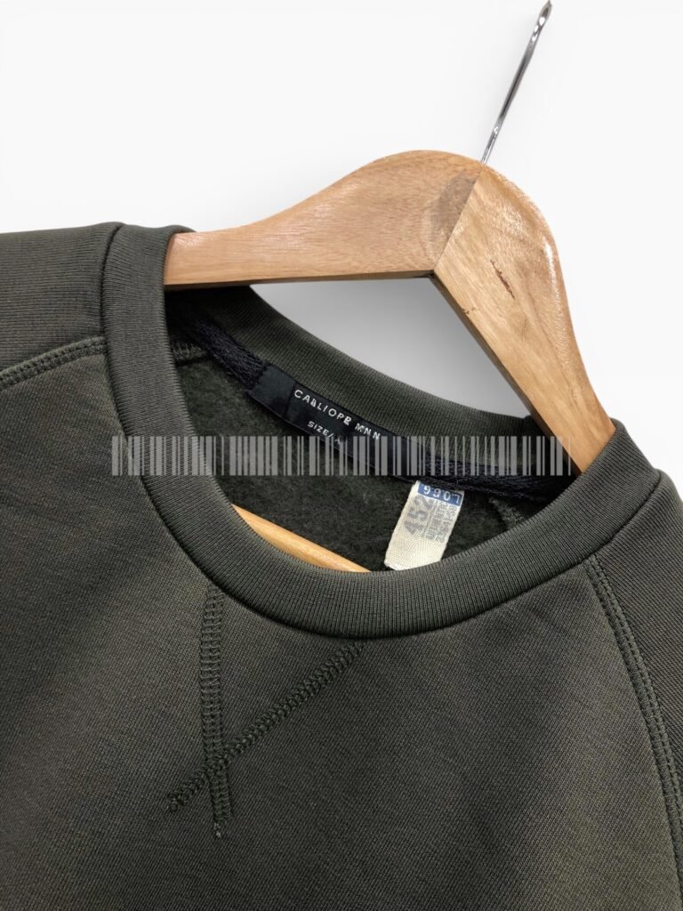 Close-up of the neckline on a charcoal sweatshirt.